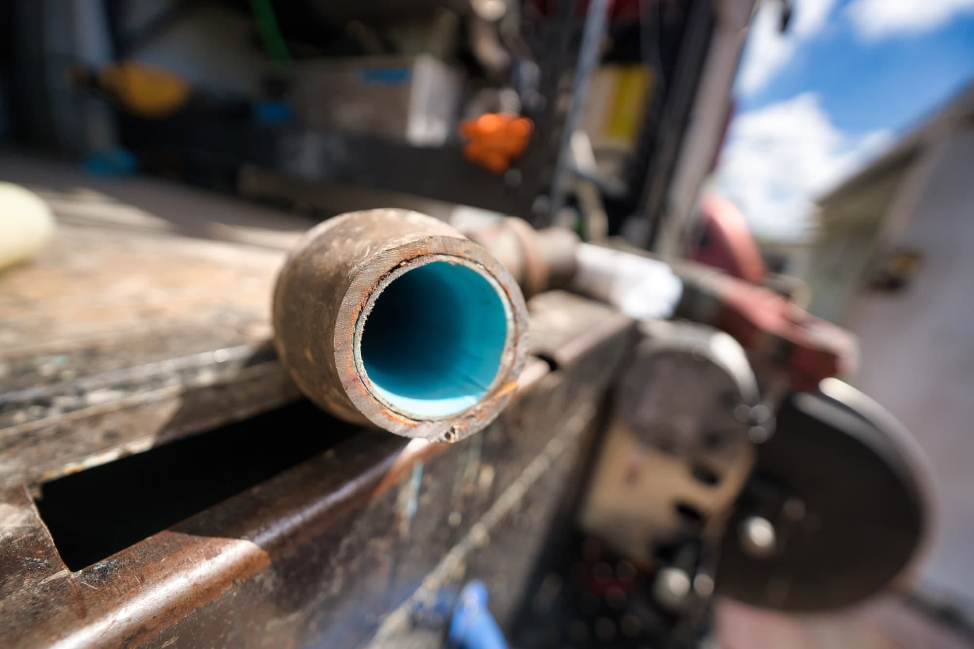 A sample of blue lined pipe showing the cured liner inside