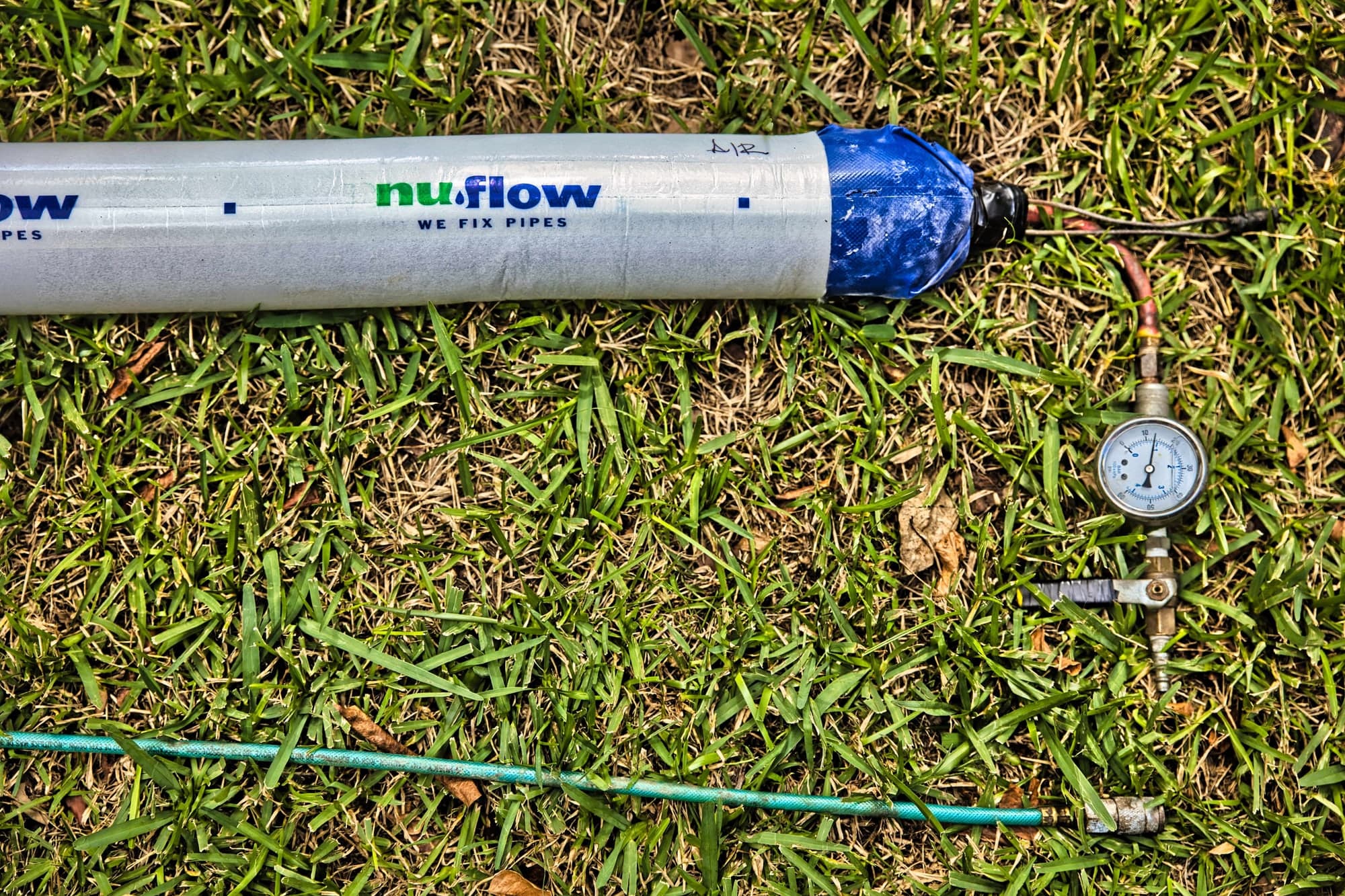 Pipe lining equipment staged on a job site